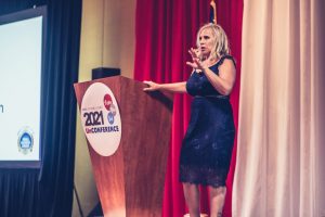 Melissa A. Washington speaking on stage at the 2021 Women Veterans UNconference
