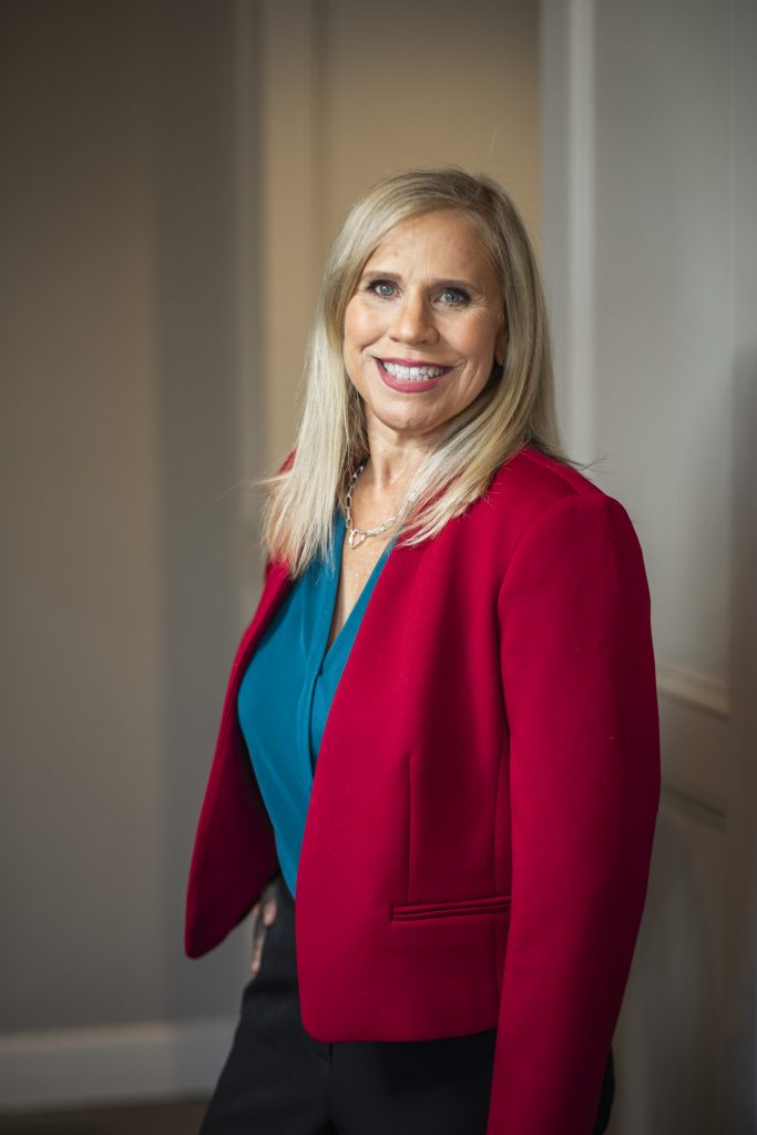 Melissa A. Washington in a red blazer, professional portrait